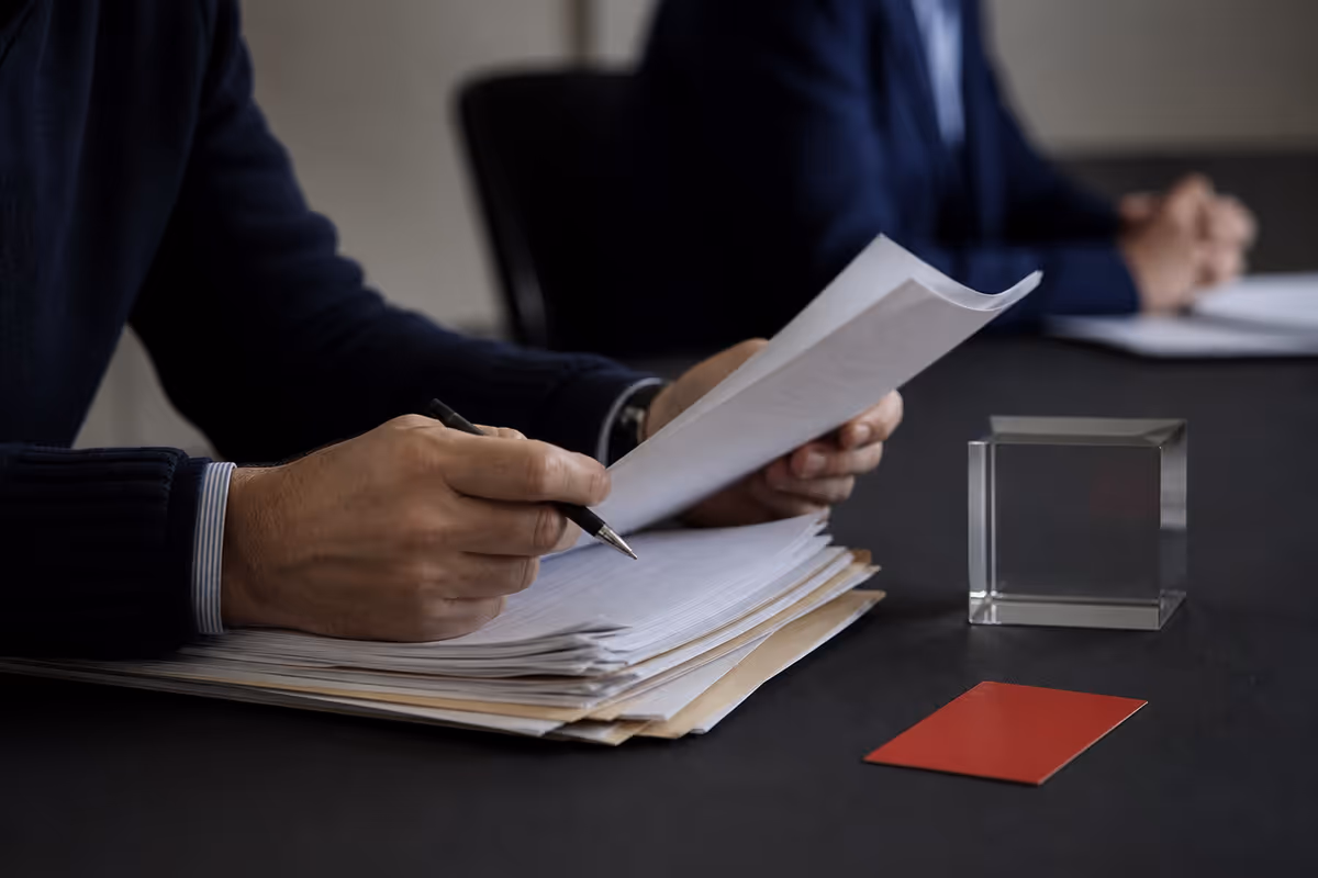Analyst reviewing an exception packet beside a stop card
