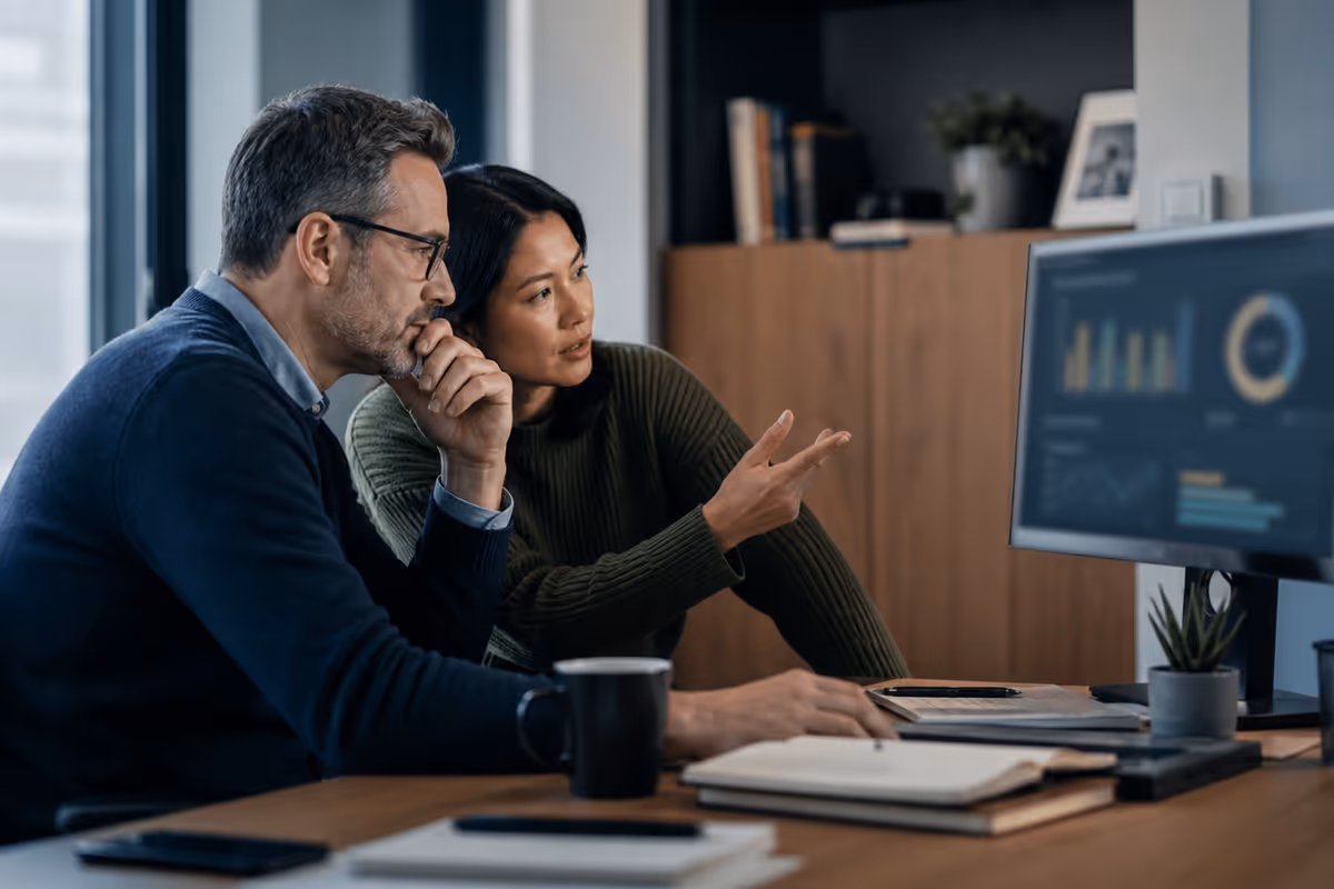 Colleagues reviewing an AI-assisted operating decision
